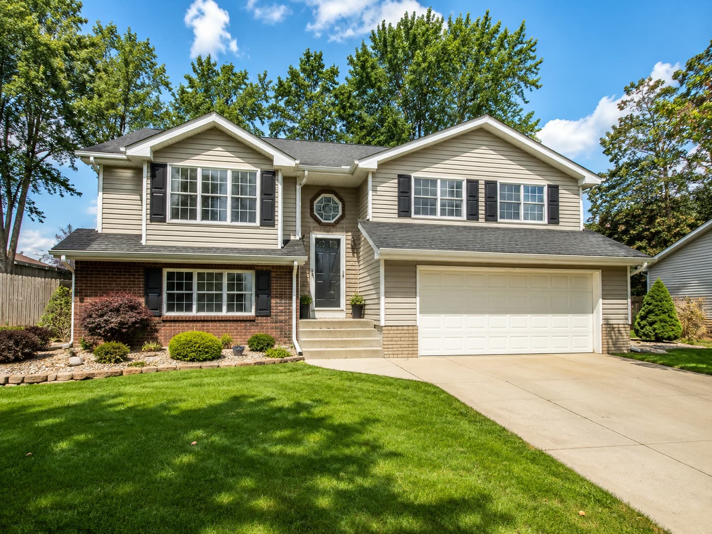 A tidy two-story rental home on a sunny street